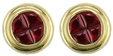 Invisibly set ruby earrings in 18kt gold.