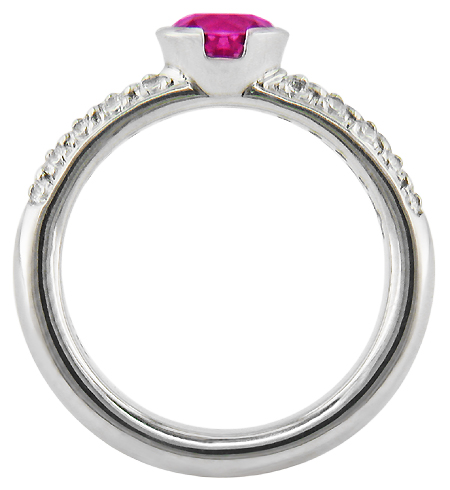 Side view of pink sapphire and pavé-set diamonds platinum ring.