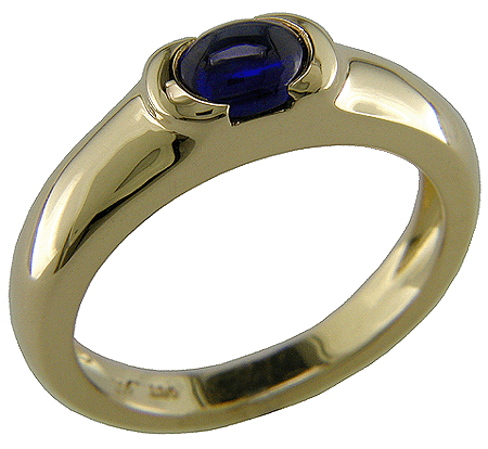 Sapphire cabochon set in 18kt gold ring.