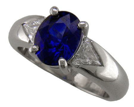 Custom designed sapphire and trilliant diamond platinum ring.