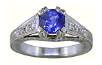 A bright sapphire set with 42 accenting diamonds in an engraved platinum ring.