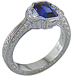 Emerald-cut saphire and half-moon diamond engraved ring.