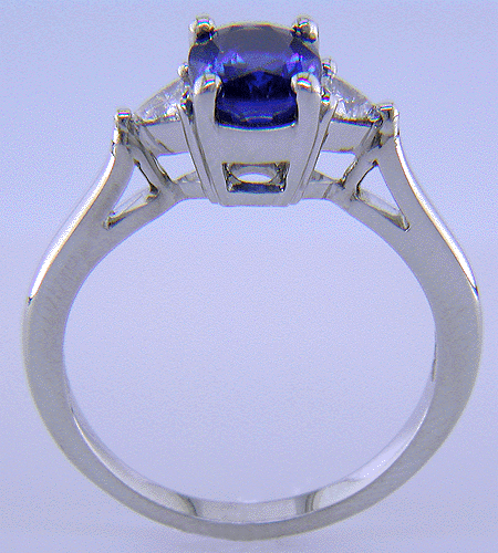 Side view of handcrafted sapphire and diamond platinum ring.
