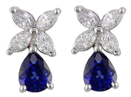 A striking pair of diamond earrings with sapphire drops.