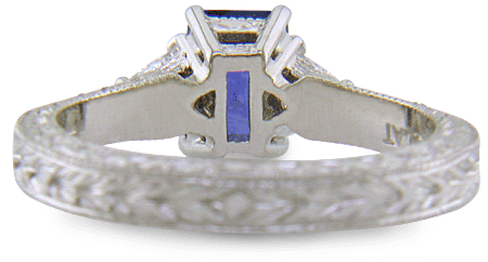 Inside view of platinum hand-engraved ring with radiant-cut sapphire and diamonds.