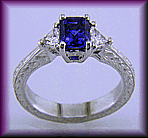 Sapphire and trilliant diamond platinum hand engraved engagement rings.