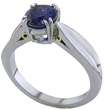 Shoulder view of sapphire ring with two hidden diamonds. (J5348)