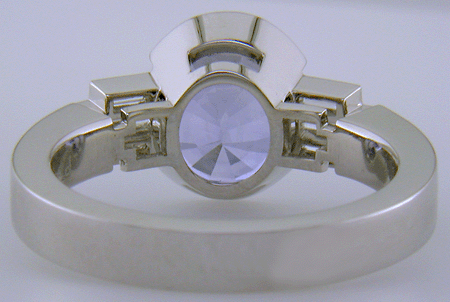 Inside view of handcrafted platinum ring with a steely blue Sapphire and sparkling baguette diamonds. (J8516)
