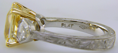 Close-up of precious metal marks ('Plat' and '750').