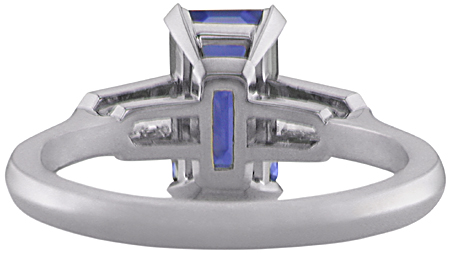 Inside view of handcrafted platinum ring with a sriking emerald-cut Sapphire and sparkling bullet-shape diamonds.