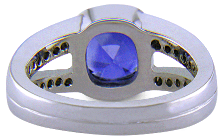 Inside view of a cushion-cut sapphire set with diamonds in a custom platinum ring. (J6654)