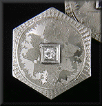 Elegantly engraved sapphire and diamond cufflinks. (J8723)