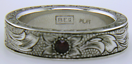 Close up of Bijoux Extraordinaire hallmark, 'BEL', and precious metal marks.
