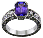 A striking engraved ring set with a beautiful violet blue sapphire.