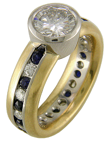 Custom designed diamond and sapphire ring crafted with satin-finished platinum and gold.