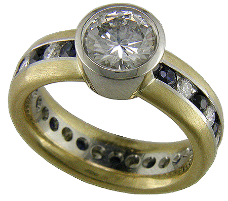 Custom diamond and sapphire ring crafted in platinum and gold.