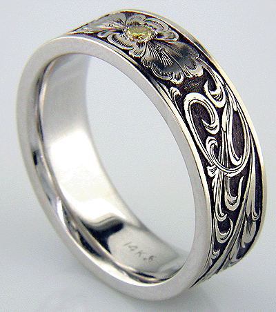 Inside of hand-engraved band set with yellow diamond.