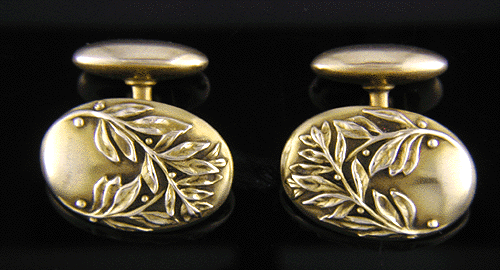 14kt gold antique cufflinks with sprig and berry motifs.
