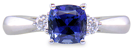 Square Cushion-cut Sapphire set with two round diamonds in a handcrafted platinum ring. (J8599)