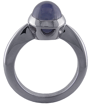 Side view of star sapphire and white gold engagement ring.