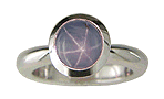 Star sapphire engagement ring with matching custom-fit band crafted in platinum.