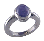 Star sapphire engagement ring with matching custom-fit band.