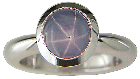 Star sapphire ring with matching custom-fit band crafted in platinum.