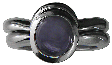 Platinum star sapphire ring with custom-fit wedding band.