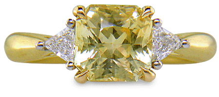 Square-radiant-cut Yellow Sapphire set with two brilliant-cut diamonds in a handcrafted 18kt gold and platinum ring. (J8711)