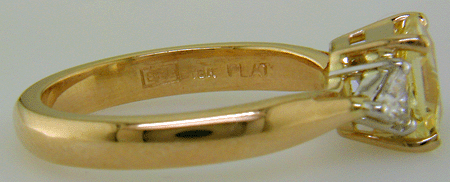 Close up of Bijoux Extraordinaire hallmark (BEL) and precious metal marks (18K, PLAT).