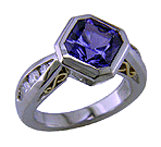 Tanzanite and diamond custom platinum ring. (J5454)