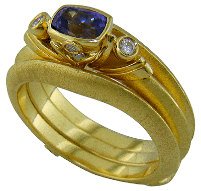 Hand-crafted 18kt gold tanzanite and diamond ring.