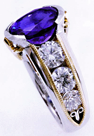 Shoulder view of custom tanzanite and diamond ring.