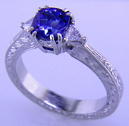 Engraved platinum ring with tanzanite and diamonds.
