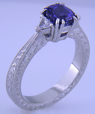 Engraved platinum ring with tanzanite and diamonds.