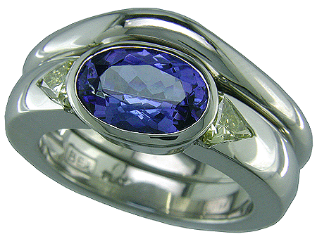 Tanzanite and fancy yellow diamonds set in a platinum engagement ring with a matching band.