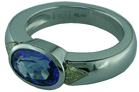 Bijoux hallmark and platinum stamp inside tanzanite and fancy yellow diamond engagement ring.