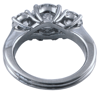 Inside view of platinum ring with three ideal cut diamonds.
