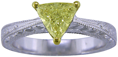Trilliant yellow diamond set in a hand-engraved platinum ring. (J5245)