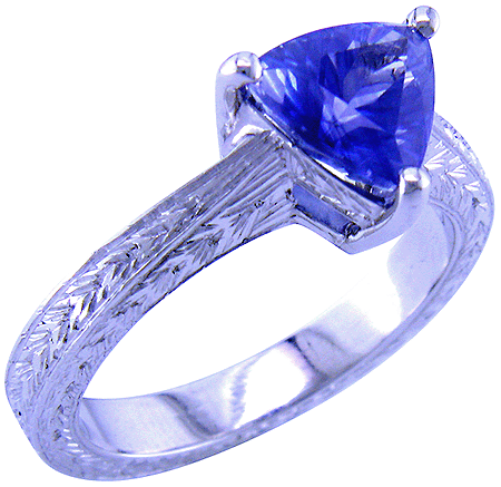 Platinum engraved ring with trillium sapphire.