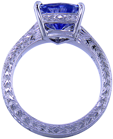 Side view of platinum engraved ring with trillium sapphire. (J5167)