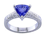 Platinum engraved ring with a trillium concave-facetted sapphire.