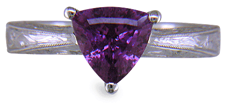Hand-engraved platinum ring with a trillium purple sapphire. (J8732)