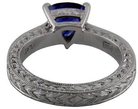 Inside view of platinum engraved ring with sapphire.