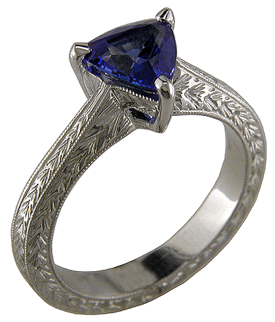 Trillium sapphire and engraved platinum engagement ring.