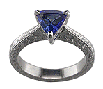 Trillium sapphire set in engraved platinum engagement rings.
