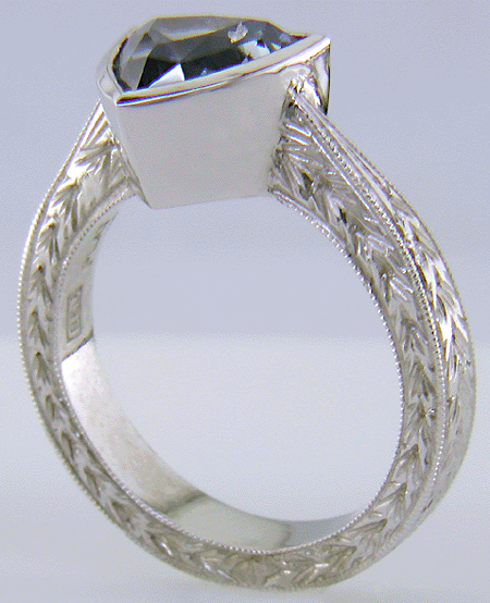 Trillium Sapphire set in engraved platinum ring. (J8517)