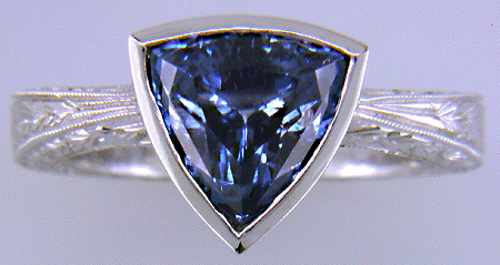 Trillium Sapphire set in engraved platinum ring. (J8517)
