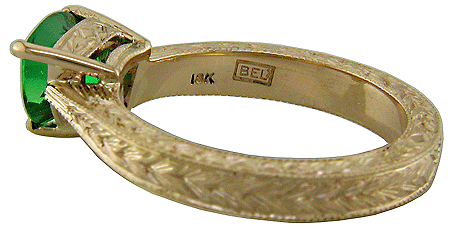 Close-up of Bijoux Extraordinaire hallmark ('BEL') and gold purity mark ('18K').