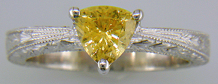 Platinum hand-engraved ring with trillium yellow sapphire.